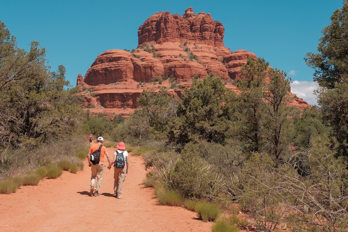 Hikers enjoying an early morning walk near Bell Rock in Sedona