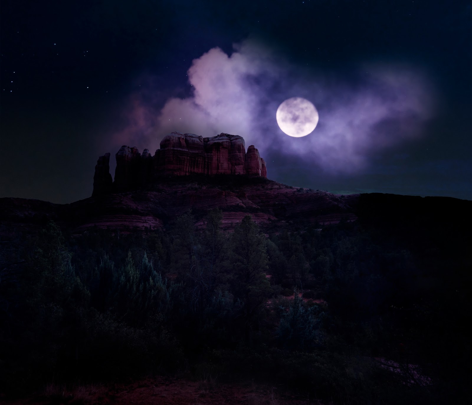 Full moon hikes in Sedona: Cathedral Rock under a bright full moon and a sky full of stars